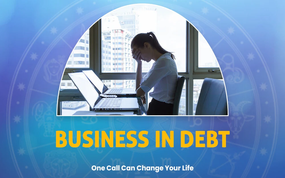 Business in debt banner showing a stressed woman sitting at a desk with a laptop, against a blue background featuring astrological symbols and text emphasizing a solution